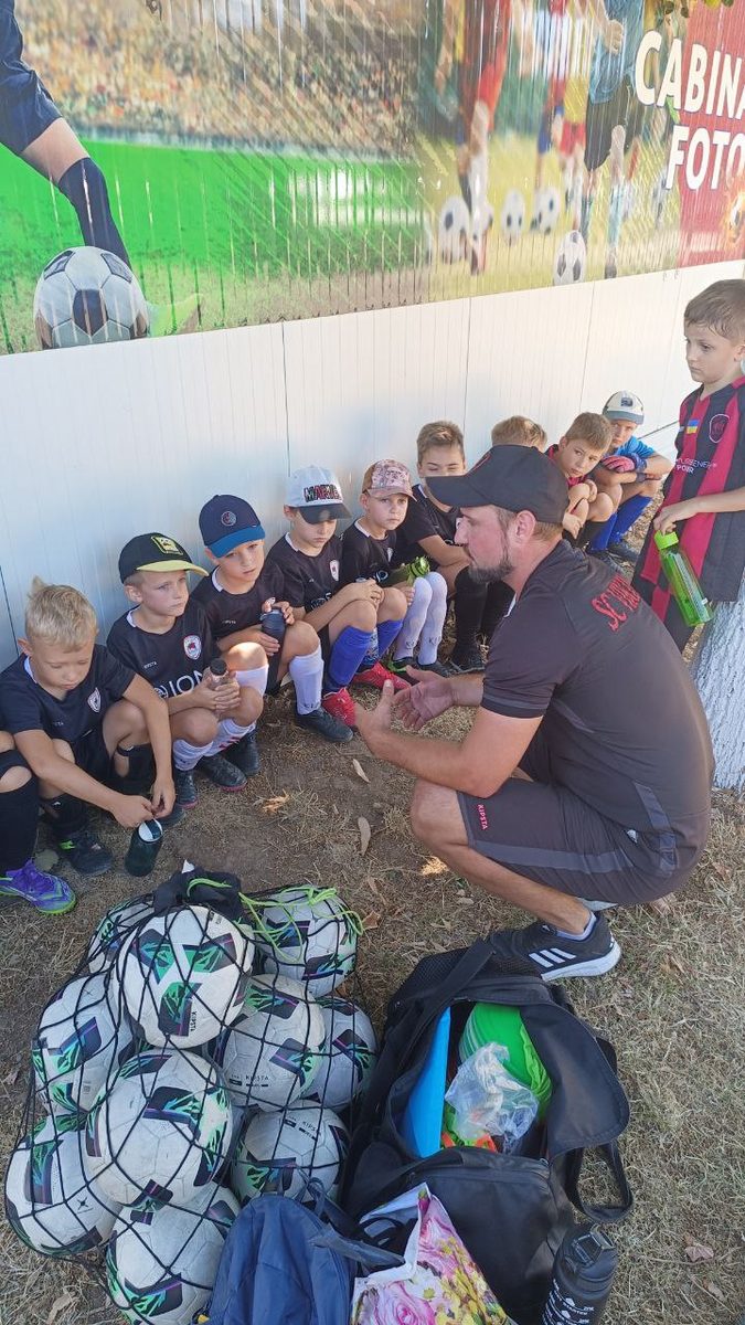 Coach with young players